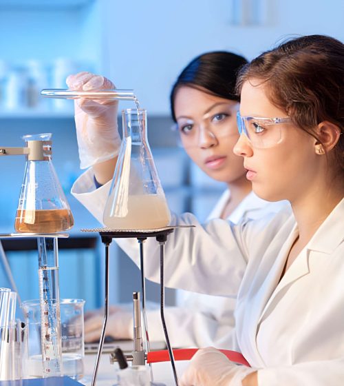 two-women-science-students-working-together-in-chemistry-education-laboratory